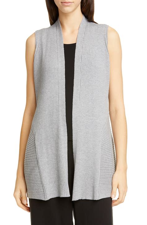 long grey sleeveless cardigan.